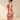 SECRET PLEASURE Lucy Set in Rot: Rotes Harness-Dessous-Set mit goldfarbenen Kettenelementen an einer Frau